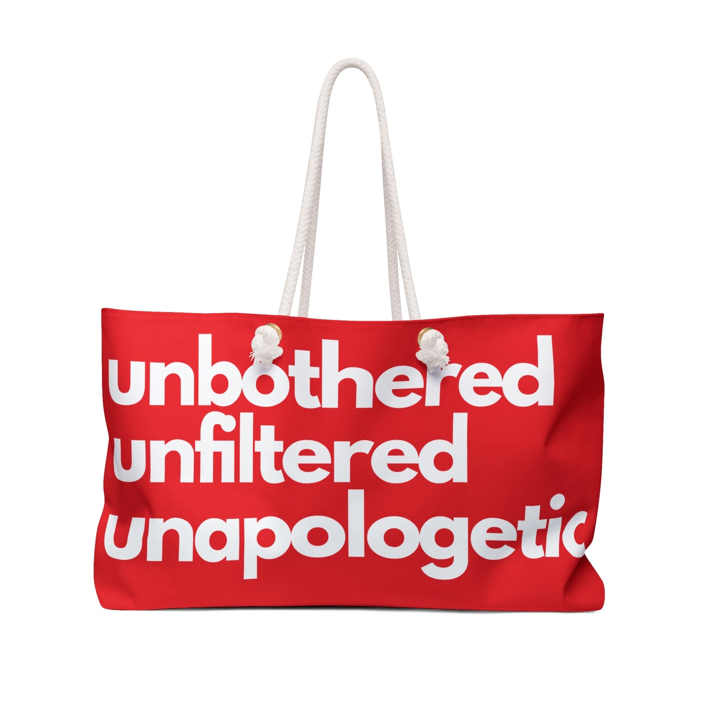 Red weekender bag with rope handles featuring the phrase “Unbothered Unfiltered Unapologetic” in bold white lettering.