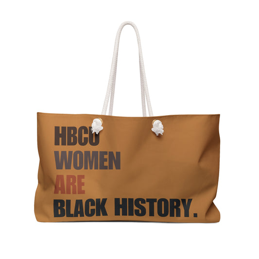 Brown weekender bag with rope handles featuring the phrase “HBCU Women Are Black History” in bold typography.