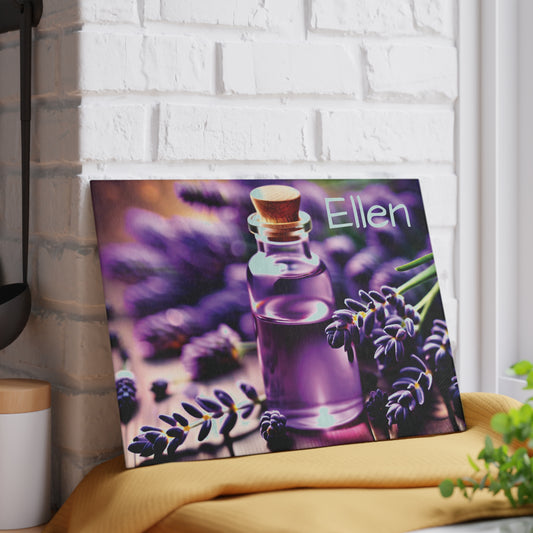 Personalized glass cutting board featuring lavender flowers and a purple oil bottle with custom name displayed on a kitchen counter.